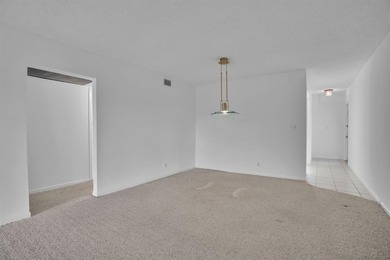 Corner residence offering stunning water views from every window on Wynmoor Golf Course in Florida - for sale on GolfHomes.com, golf home, golf lot