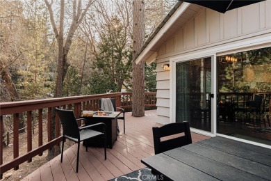 Escape to this stunning 4-bedroom, 3-bathroom mountain cabin on Lake Arrowhead Country Club in California - for sale on GolfHomes.com, golf home, golf lot