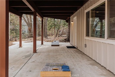 Escape to this stunning 4-bedroom, 3-bathroom mountain cabin on Lake Arrowhead Country Club in California - for sale on GolfHomes.com, golf home, golf lot