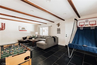 Escape to this stunning 4-bedroom, 3-bathroom mountain cabin on Lake Arrowhead Country Club in California - for sale on GolfHomes.com, golf home, golf lot