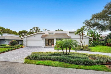 An exceptional, fully renovated retreat tucked behind a tranquil on Hamlet Country Club in Florida - for sale on GolfHomes.com, golf home, golf lot