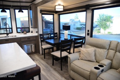Modern living in this 2022 Cedar Creek Cottage, Destination RV on Juniper Ridge R.V. Golf Resort in Arizona - for sale on GolfHomes.com, golf home, golf lot