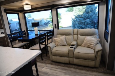 Modern living in this 2022 Cedar Creek Cottage, Destination RV on Juniper Ridge R.V. Golf Resort in Arizona - for sale on GolfHomes.com, golf home, golf lot