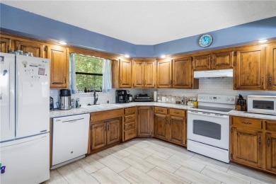 Welcome home to this well-maintained split-level residence on Bella Vista Country Club and Golf Course in Arkansas - for sale on GolfHomes.com, golf home, golf lot