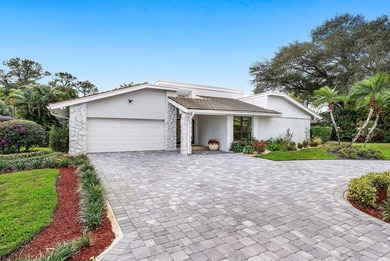 An exceptional, fully renovated retreat tucked behind a tranquil on Hamlet Country Club in Florida - for sale on GolfHomes.com, golf home, golf lot
