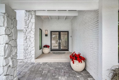 An exceptional, fully renovated retreat tucked behind a tranquil on Hamlet Country Club in Florida - for sale on GolfHomes.com, golf home, golf lot