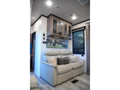 Modern living in this 2022 Cedar Creek Cottage, Destination RV on Juniper Ridge R.V. Golf Resort in Arizona - for sale on GolfHomes.com, golf home, golf lot