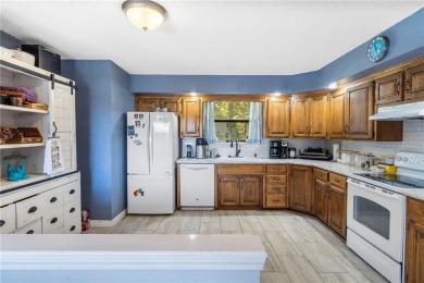 Welcome home to this well-maintained split-level residence on Bella Vista Country Club and Golf Course in Arkansas - for sale on GolfHomes.com, golf home, golf lot