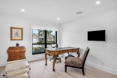 An exceptional, fully renovated retreat tucked behind a tranquil on Hamlet Country Club in Florida - for sale on GolfHomes.com, golf home, golf lot