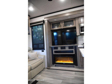 Modern living in this 2022 Cedar Creek Cottage, Destination RV on Juniper Ridge R.V. Golf Resort in Arizona - for sale on GolfHomes.com, golf home, golf lot