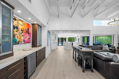 An exceptional, fully renovated retreat tucked behind a tranquil on Hamlet Country Club in Florida - for sale on GolfHomes.com, golf home, golf lot