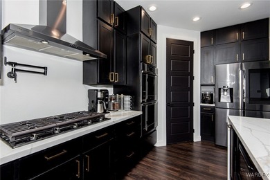 Presenting 6393 S Via De Oro, Fort Mohave, Arizona, a custom on Los Lagos Golf Club in Arizona - for sale on GolfHomes.com, golf home, golf lot