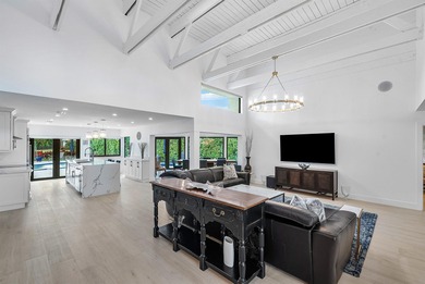 An exceptional, fully renovated retreat tucked behind a tranquil on Hamlet Country Club in Florida - for sale on GolfHomes.com, golf home, golf lot