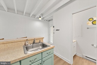 Beautifully renovated pond-front coastal retreat located just 2 on Bayside Resort Golf Club in Delaware - for sale on GolfHomes.com, golf home, golf lot