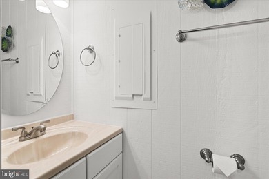 Beautifully renovated pond-front coastal retreat located just 2 on Bayside Resort Golf Club in Delaware - for sale on GolfHomes.com, golf home, golf lot