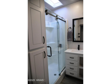 Modern living in this 2022 Cedar Creek Cottage, Destination RV on Juniper Ridge R.V. Golf Resort in Arizona - for sale on GolfHomes.com, golf home, golf lot