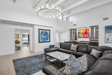 An exceptional, fully renovated retreat tucked behind a tranquil on Hamlet Country Club in Florida - for sale on GolfHomes.com, golf home, golf lot