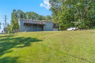 Welcome home to this well-maintained split-level residence on Bella Vista Country Club and Golf Course in Arkansas - for sale on GolfHomes.com, golf home, golf lot