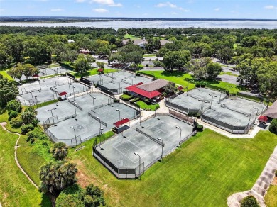 Come discover this stunning residence situated in Harbor Hills on Harbor Hills Country Club in Florida - for sale on GolfHomes.com, golf home, golf lot