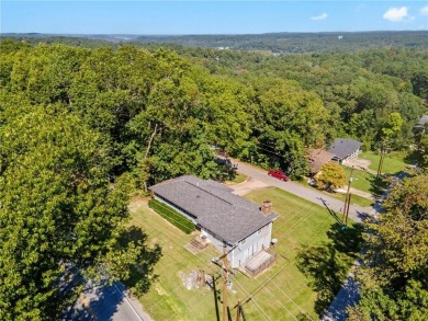 Welcome home to this well-maintained split-level residence on Bella Vista Country Club and Golf Course in Arkansas - for sale on GolfHomes.com, golf home, golf lot
