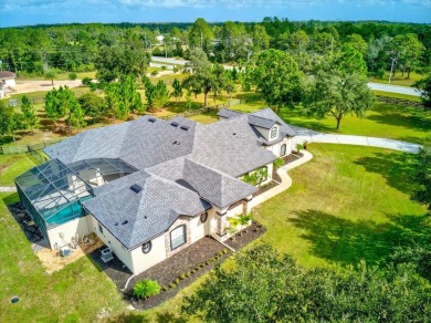 Quiet Country Living on over 4 ACRES! NOV 2023 ROOF! This on Wedgefield Golf Club in Florida - for sale on GolfHomes.com, golf home, golf lot