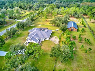 Quiet Country Living on over 4 ACRES! NOV 2023 ROOF! This on Wedgefield Golf Club in Florida - for sale on GolfHomes.com, golf home, golf lot