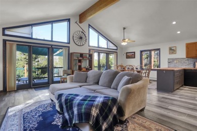 This cozy mountain retreat boasts 3 bedrooms, 2 baths, and a on Grand Lake Golf Course in Colorado - for sale on GolfHomes.com, golf home, golf lot