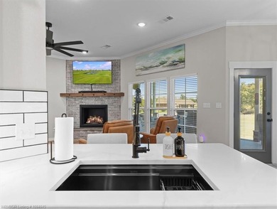 This stunning 4-bedroom, 2-bath home blends modern design with on Wolf Ridge Golf Course in Oklahoma - for sale on GolfHomes.com, golf home, golf lot