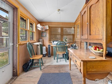 Step inside this charming rustic cabin that offers a peaceful on Estes Park Golf Course in Colorado - for sale on GolfHomes.com, golf home, golf lot