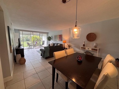 ***Charming and inviting 2nd floor unit offering a peaceful view on Palm-Aire Country Club and Resort - Palms in Florida - for sale on GolfHomes.com, golf home, golf lot