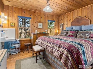 Step inside this charming rustic cabin that offers a peaceful on Estes Park Golf Course in Colorado - for sale on GolfHomes.com, golf home, golf lot