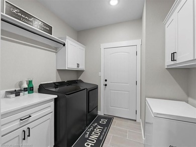 This stunning 4-bedroom, 2-bath home blends modern design with on Wolf Ridge Golf Course in Oklahoma - for sale on GolfHomes.com, golf home, golf lot