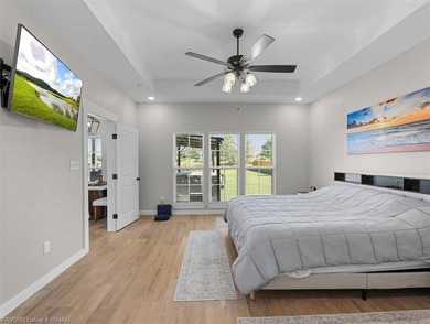 This stunning 4-bedroom, 2-bath home blends modern design with on Wolf Ridge Golf Course in Oklahoma - for sale on GolfHomes.com, golf home, golf lot