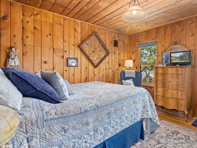 Step inside this charming rustic cabin that offers a peaceful on Estes Park Golf Course in Colorado - for sale on GolfHomes.com, golf home, golf lot