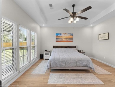 This stunning 4-bedroom, 2-bath home blends modern design with on Wolf Ridge Golf Course in Oklahoma - for sale on GolfHomes.com, golf home, golf lot