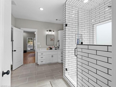 This stunning 4-bedroom, 2-bath home blends modern design with on Wolf Ridge Golf Course in Oklahoma - for sale on GolfHomes.com, golf home, golf lot