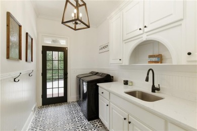 Exquisite and beautifully updated home nestled in the exclusive on The Golf Club of Georgia in Georgia - for sale on GolfHomes.com, golf home, golf lot