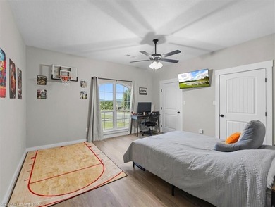 This stunning 4-bedroom, 2-bath home blends modern design with on Wolf Ridge Golf Course in Oklahoma - for sale on GolfHomes.com, golf home, golf lot