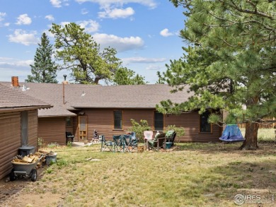 Step inside this charming rustic cabin that offers a peaceful on Estes Park Golf Course in Colorado - for sale on GolfHomes.com, golf home, golf lot