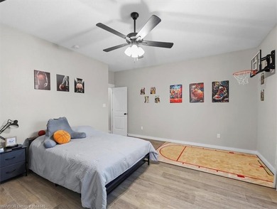 This stunning 4-bedroom, 2-bath home blends modern design with on Wolf Ridge Golf Course in Oklahoma - for sale on GolfHomes.com, golf home, golf lot