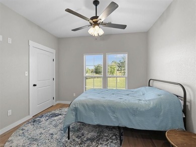 This stunning 4-bedroom, 2-bath home blends modern design with on Wolf Ridge Golf Course in Oklahoma - for sale on GolfHomes.com, golf home, golf lot