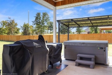 This stunning 4-bedroom, 2-bath home blends modern design with on Wolf Ridge Golf Course in Oklahoma - for sale on GolfHomes.com, golf home, golf lot