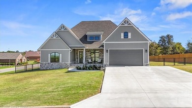 This stunning 4-bedroom, 2-bath home blends modern design with on Wolf Ridge Golf Course in Oklahoma - for sale on GolfHomes.com, golf home, golf lot