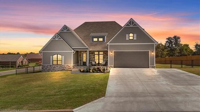 This stunning 4-bedroom, 2-bath home blends modern design with on Wolf Ridge Golf Course in Oklahoma - for sale on GolfHomes.com, golf home, golf lot
