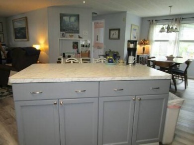 This charming 24 x 40, 2 bedrooms, 2 bath mobile home offers the on Grasslands Golf and Country Club in Florida - for sale on GolfHomes.com, golf home, golf lot