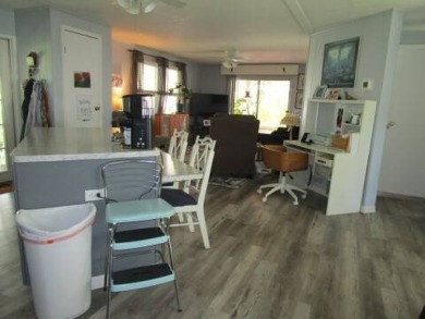 This charming 24 x 40, 2 bedrooms, 2 bath mobile home offers the on Grasslands Golf and Country Club in Florida - for sale on GolfHomes.com, golf home, golf lot