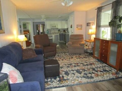This charming 24 x 40, 2 bedrooms, 2 bath mobile home offers the on Grasslands Golf and Country Club in Florida - for sale on GolfHomes.com, golf home, golf lot