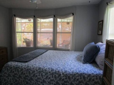 This charming 24 x 40, 2 bedrooms, 2 bath mobile home offers the on Grasslands Golf and Country Club in Florida - for sale on GolfHomes.com, golf home, golf lot