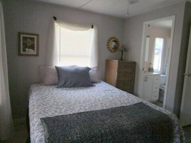 This charming 24 x 40, 2 bedrooms, 2 bath mobile home offers the on Grasslands Golf and Country Club in Florida - for sale on GolfHomes.com, golf home, golf lot