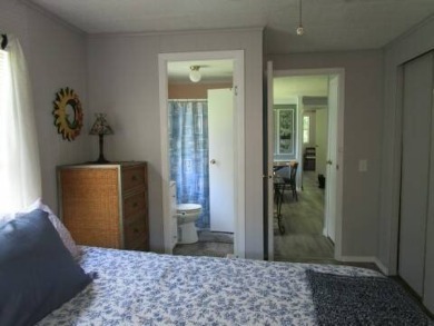 This charming 24 x 40, 2 bedrooms, 2 bath mobile home offers the on Grasslands Golf and Country Club in Florida - for sale on GolfHomes.com, golf home, golf lot